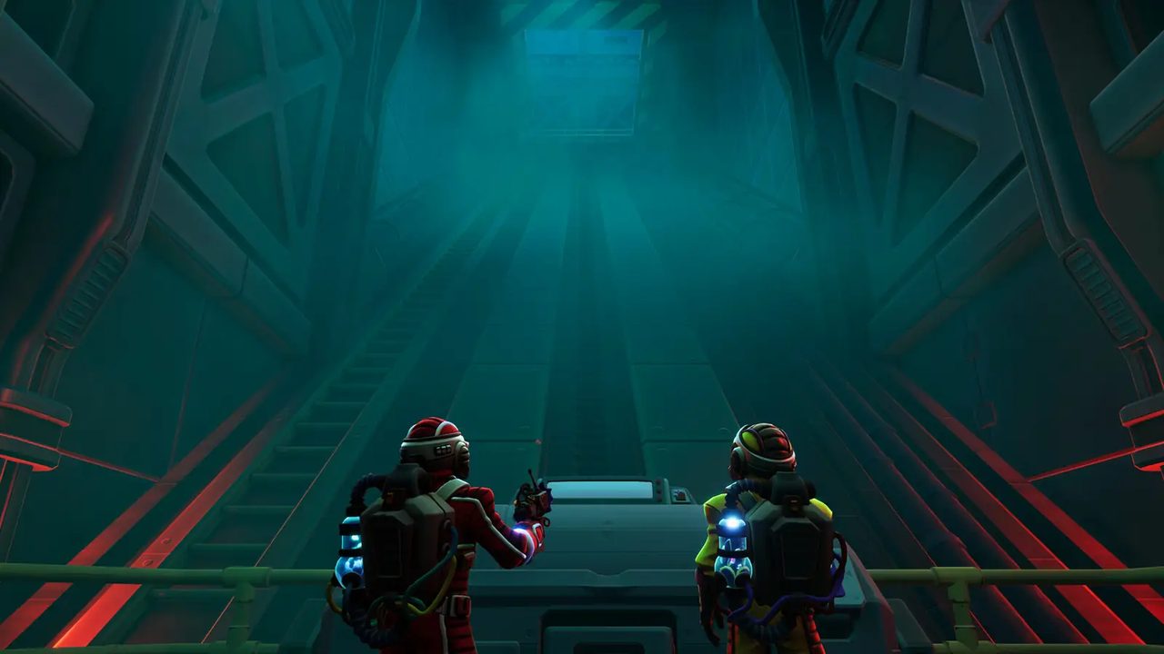 Two explorers at the base of a towering industrial elevator shaft